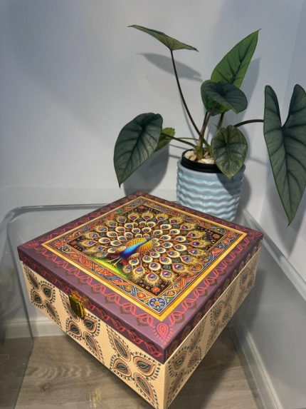 Beige and maroon square 4-jar gift box with ornate peacock illustration and gold latch