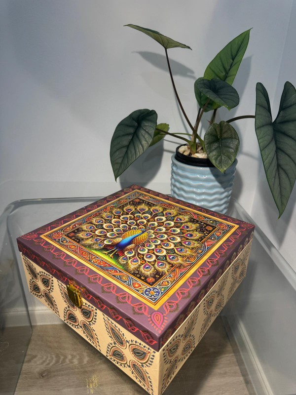 Beige and maroon square 4-jar gift box Beige and maroon square 4-jar gift box with ornate peacock illustration and gold latch